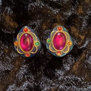 Clip on earrings with large centered pink stone